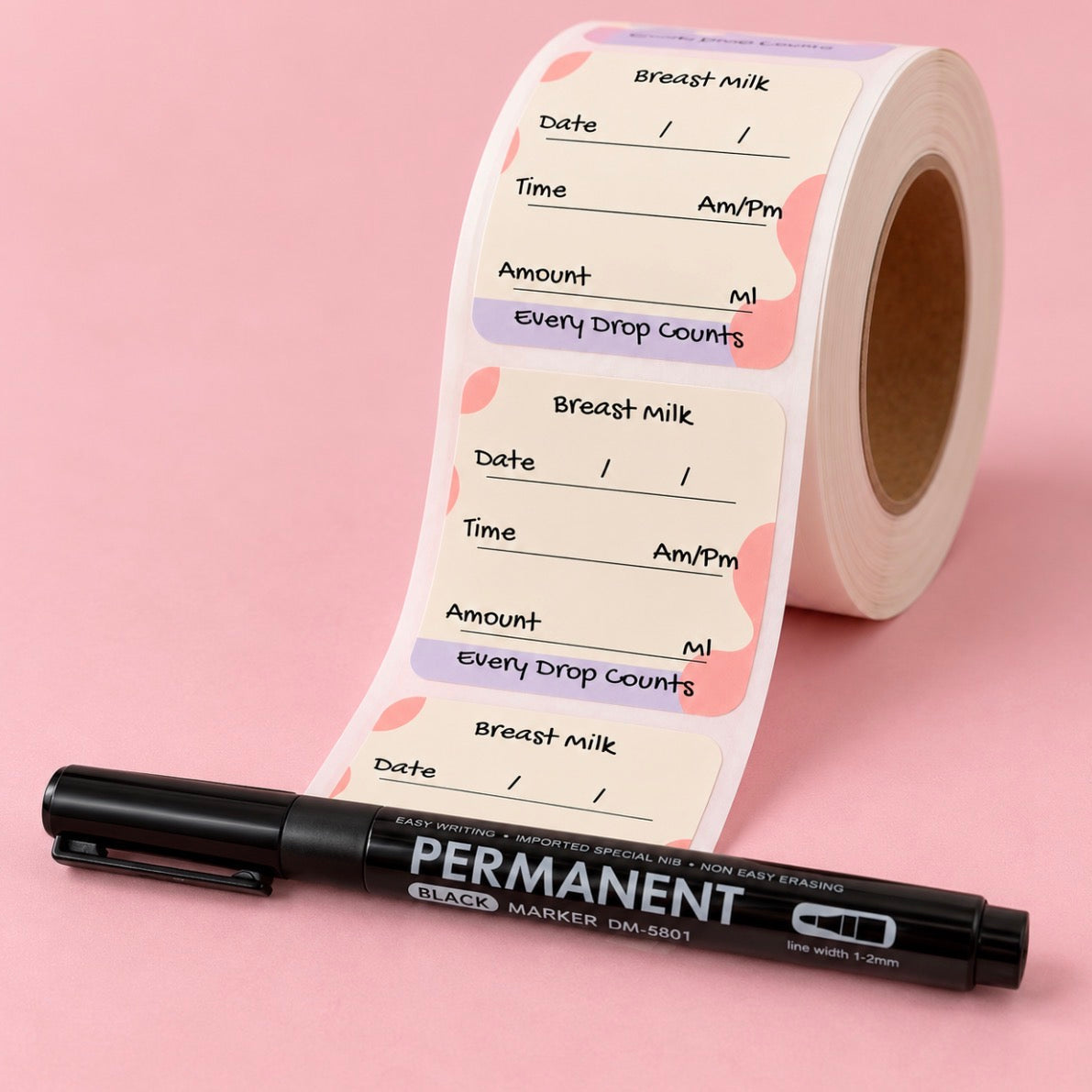 A roll of breast milk tracking stickers with a black permanent marker placed in front on a soft pink background. The stickers feature fields for date, time, amount, and drop count, decorated with pastel pink and lavender shapes.