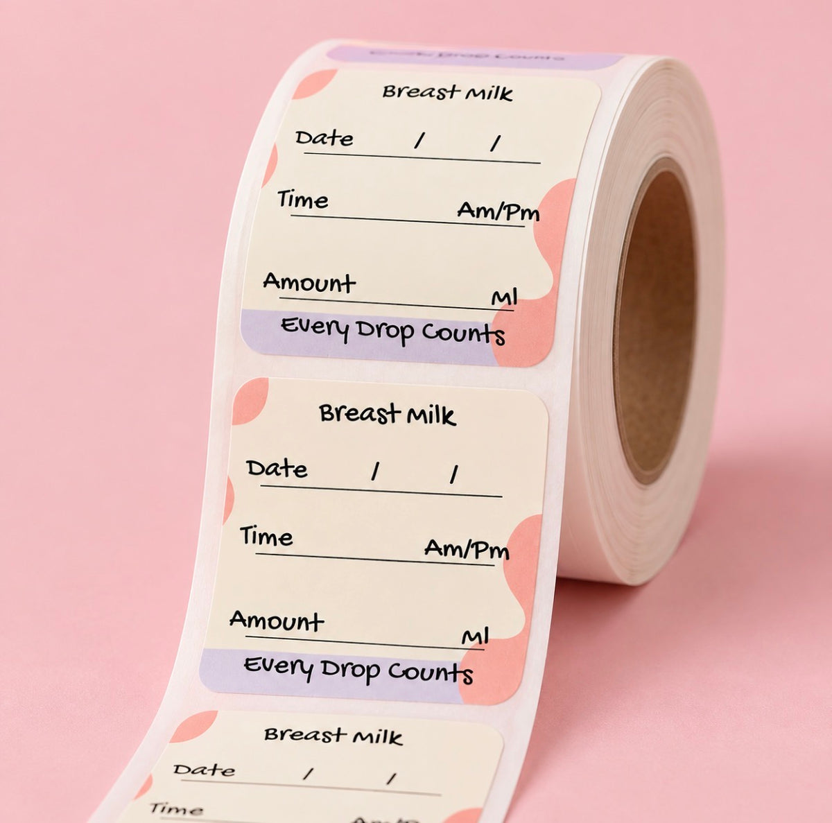 A roll of breast milk drop count labels on a soft pink background. The labels are cream-colored with pink and lavender abstract shapes and fields for date, time, and amount.