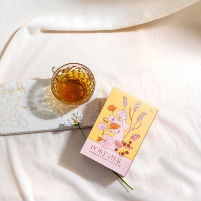 Tea cup and box on a white fabric background